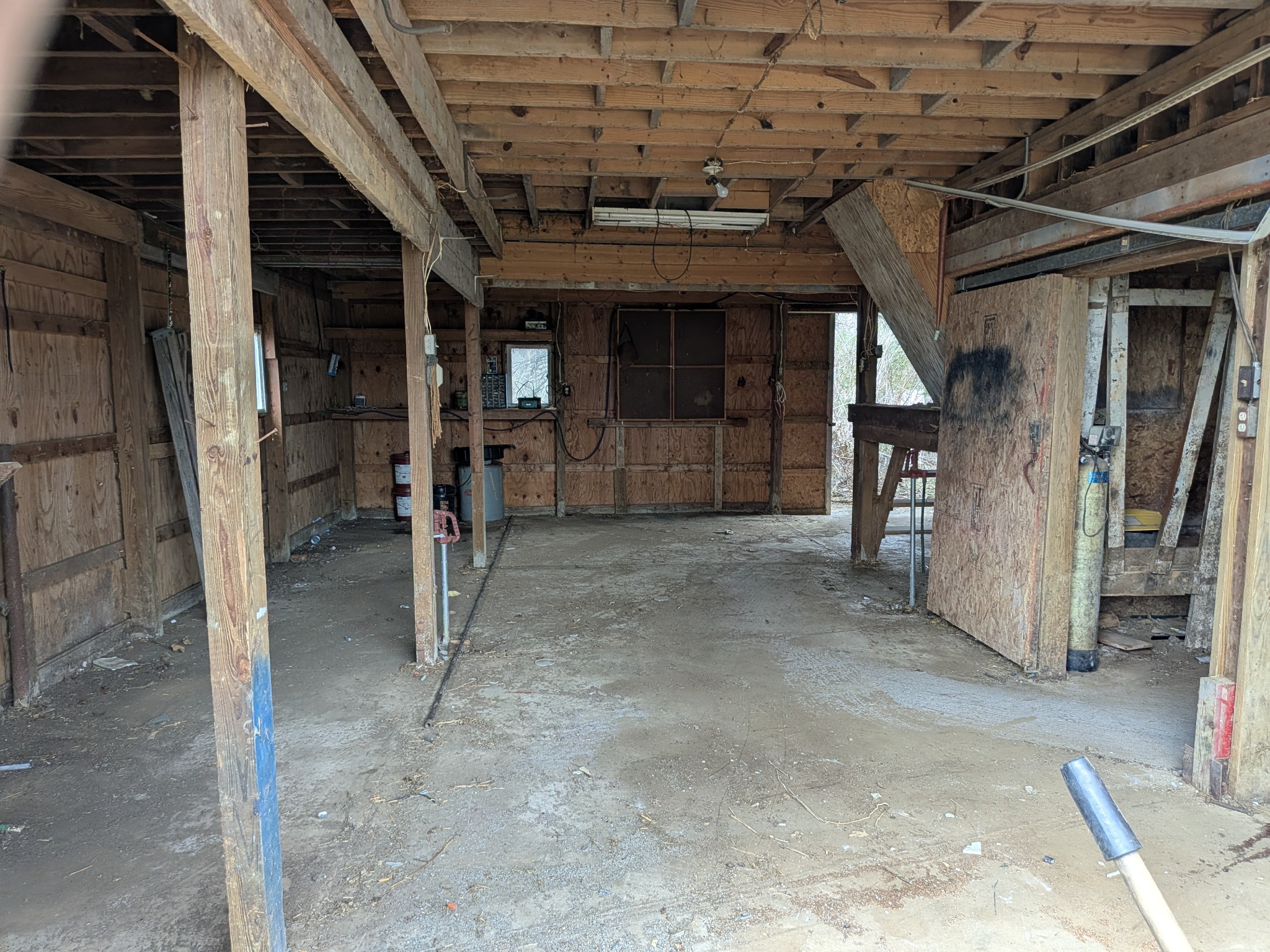 Cleared interior of an outbuilding after cleanout work